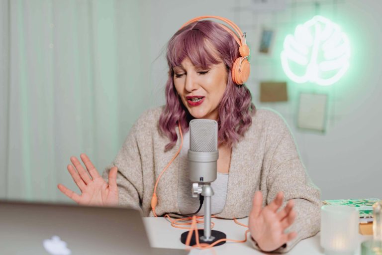 a woman speaking into a microphone